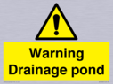 warning-drainage-pond~